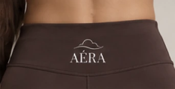 AÉRA logo on the back of the dark brown leggings waistband
